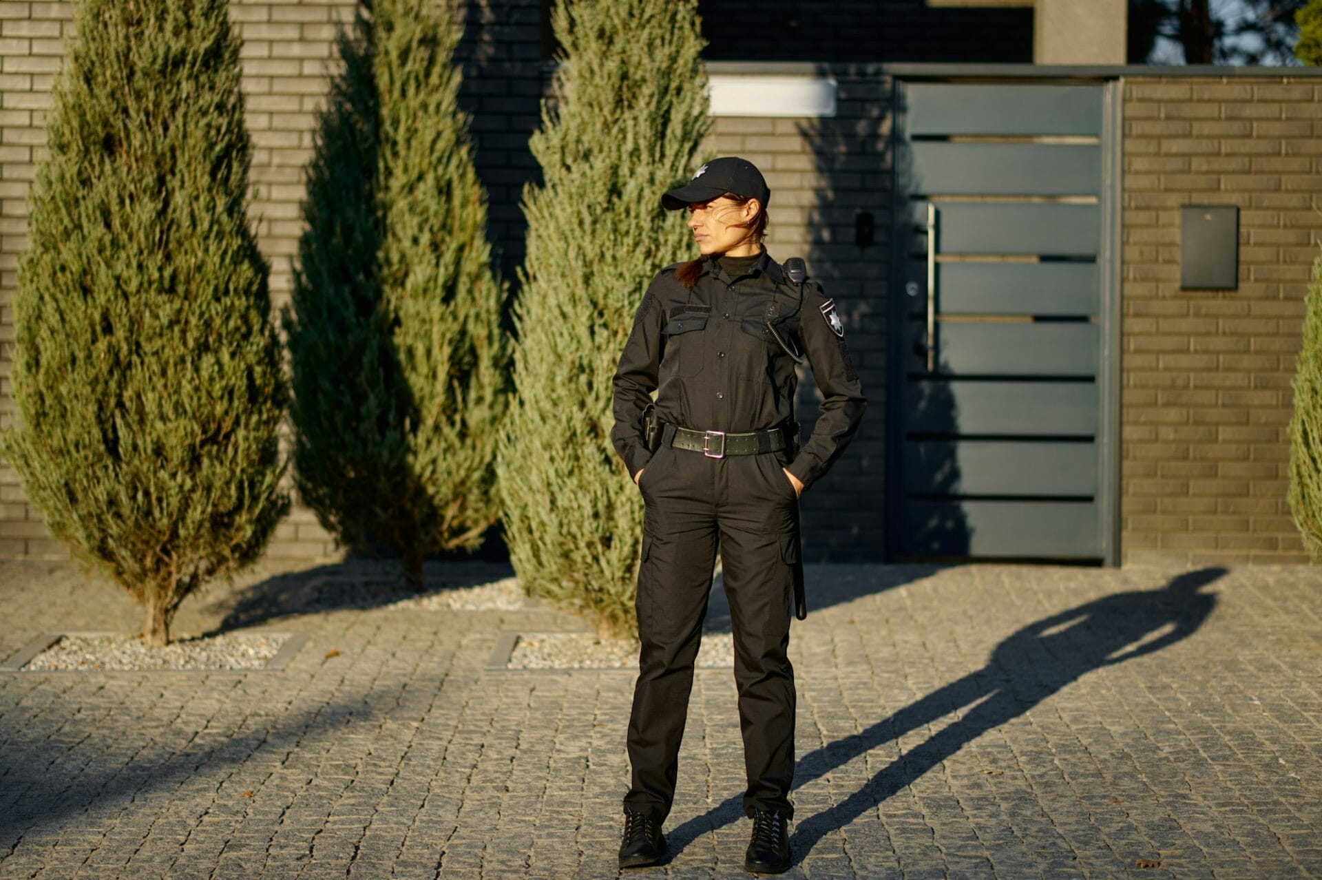 Woman police officer on street full-length portrait